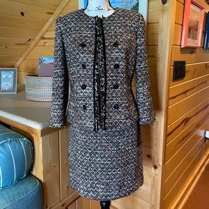 Black chenille, two piece suit with multicolor accents, by Tahari.